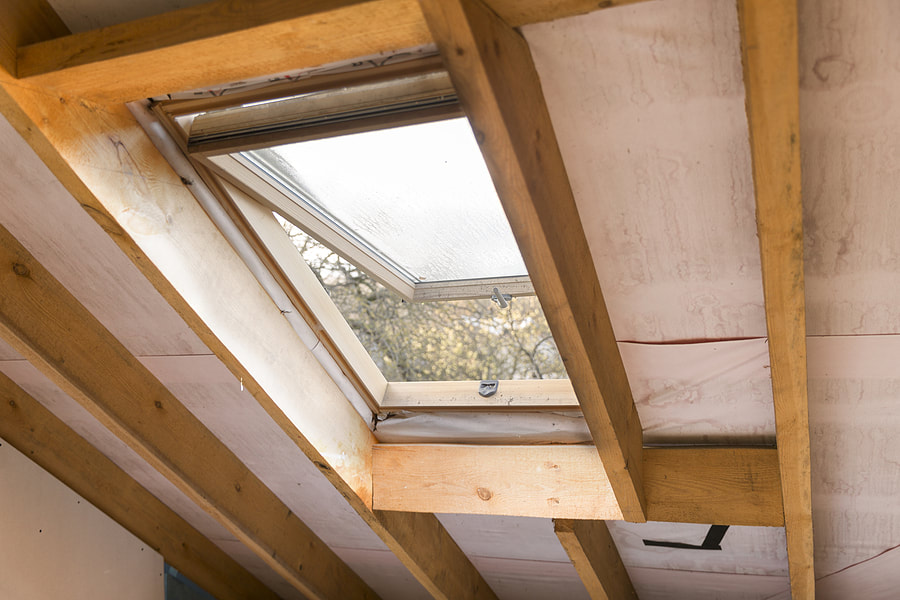 a wood skylight at the attic