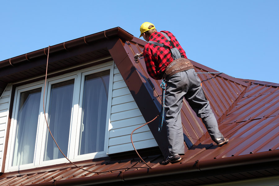 man repairing the roof