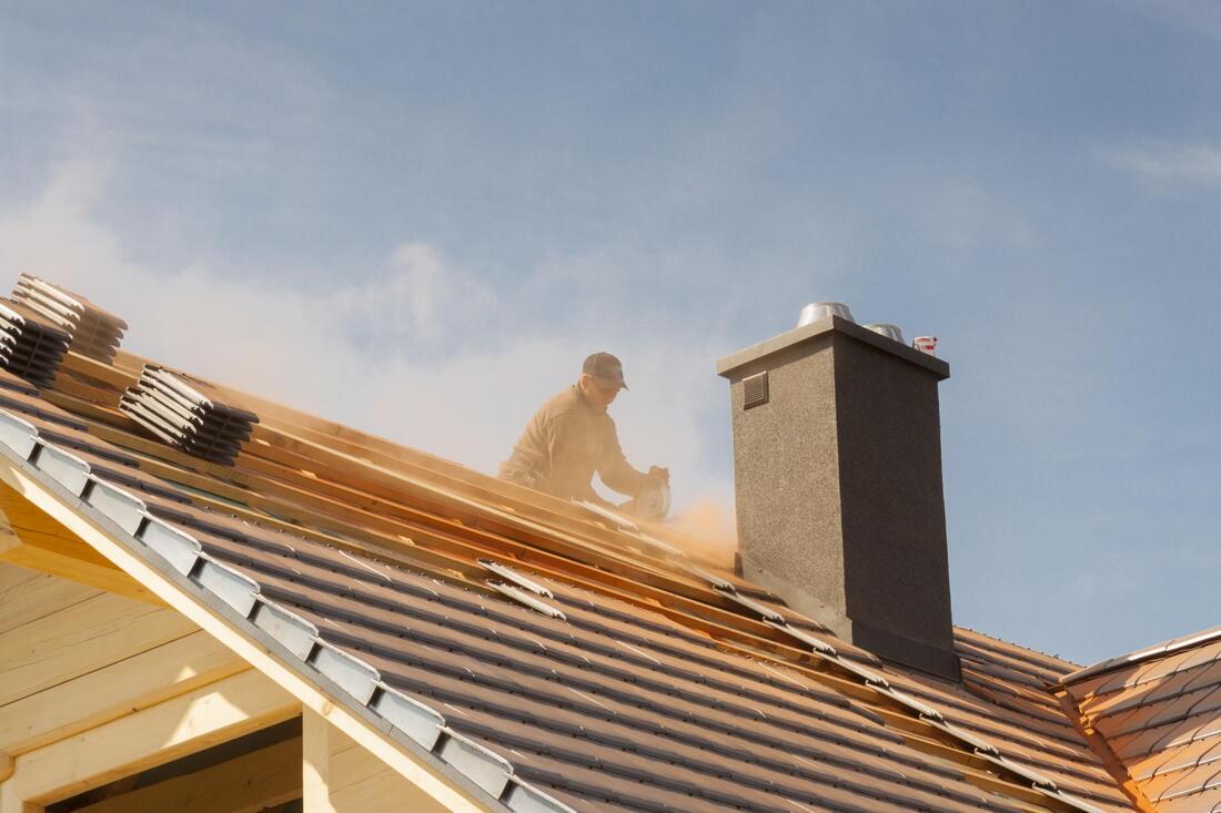 a man installing roof